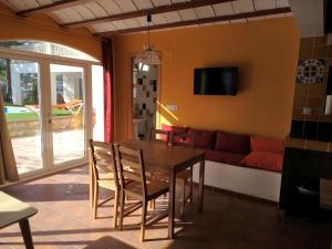a living room with a table and a couch at Allotjament Bogues in Lloret de Mar