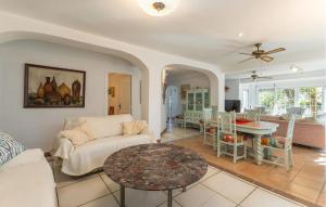 a living room with a couch and a table at Stunning Home In El Campello in El Campello