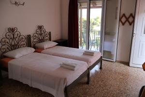 A bed or beds in a room at Filippos Apartments "Room 5" No kitchen