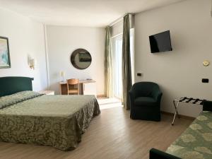Postel nebo postele na pokoji v ubytování Hotel Carlton + 37 fotografií