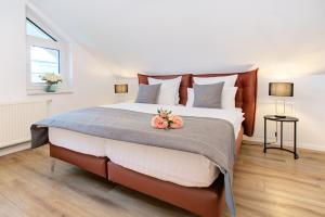 Postel nebo postele na pokoji v ubytování Blumen(t)raum Ferienwohnung 3