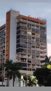 a building with a sign on top of it at MIX APART Hotel in Brasília
