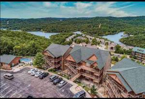 an aerial view of a large house with a parking lot at Panoramic Penthouse at SDC in Branson