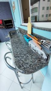 a glass table with skis on top of it at Half Beach Apartment - Itapema in Itapema