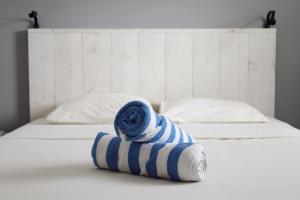 Postel nebo postele na pokoji v ubytování Palm Crest Curacao 151B