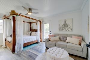 a living room with a bed and a couch at Steps to Sand! Topsail Beach Group Getaway! in Surf City
