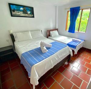 Hotel Davilejas客房内的一张或多张床位