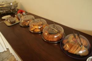 
doughnuts are arranged on a table at Hotel Platon in Faliraki
