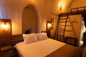 Postel nebo postele na pokoji v ubytování Lemon Cave Suites