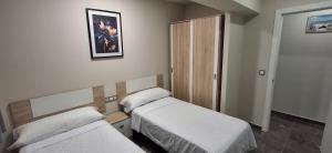 Postel nebo postele na pokoji v ubytování Apartamentos solymar oropesa del mar