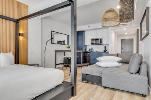 Ένα ή περισσότερα κρεβάτια σε δωμάτιο στο Initial / Libre / Centre-ville de Quebec