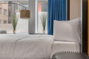 Ένα ή περισσότερα κρεβάτια σε δωμάτιο στο Initial / Libre / Centre-ville de Quebec