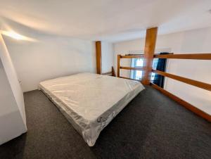 a bedroom with a bed in a room with a window at Studio in Hyper Centre Close to All Amenities in Grenoble