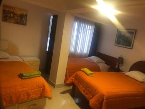 Rúm í herbergi á Tambo Cusco Inn