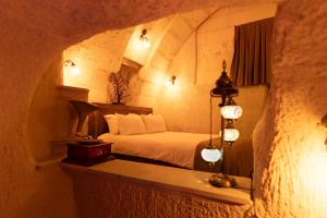 Postel nebo postele na pokoji v ubytování Lemon Cave Suites