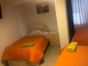 Rúm í herbergi á Tambo Cusco Inn
