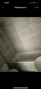 a white ceiling in a bathroom with a sink at Denton House in Manchester +12 photos