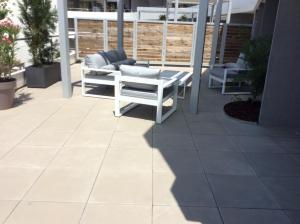 a shadow of a bench on a patio at Les plages du Grand Vallen - Résidence Château Leenhardt in Le Grau-du-Roi +35 photos