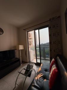Uma área de estar em Unixx Pattaya High floor view