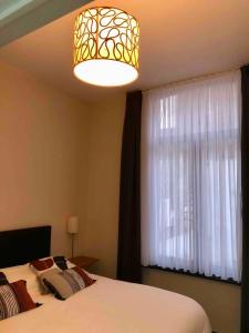 Postel nebo postele na pokoji v ubytování Cosy 1 bedroom apartment in EU DISTRICT