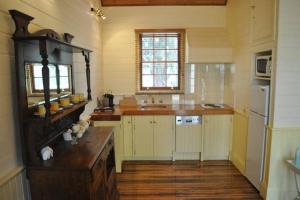 a kitchen with a counter and a sink in it at The Mill House Cottage in Richmond