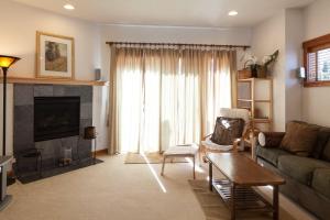 a living room with a couch and a table at Venturi 30 day minimum in Hood River