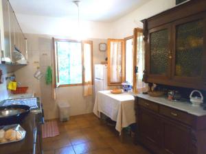 a kitchen with a table in the corner of the room at Villa Costanza in San Giovanni