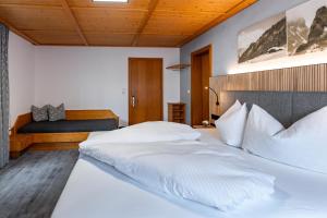 Posteľ alebo postele v izbe v ubytovaní Hotel Garni Madrisa