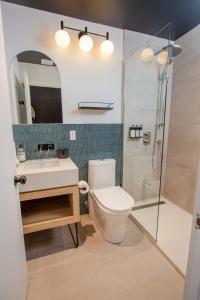 a bathroom with a toilet and a sink and a shower at Studio #5 - Self Check-In - Plateau - St-Denis in Montreal