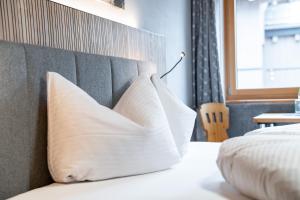 Posteľ alebo postele v izbe v ubytovaní Hotel Garni Madrisa