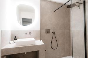 a bathroom with a sink and a shower at Cathedral View luxurious Apartment in Antwerp +41 photos