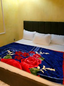 A bed or beds in a room at Protocol Court and Suites