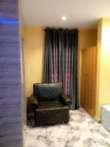 A seating area at Protocol Court and Suites