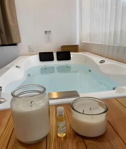 a bath tub with two candles in front of it at Villas Buenos Aires / Comodidad y estilo cerca del pueblo in Mazamitla