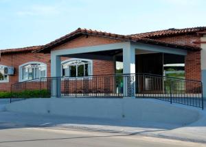 a house with a ramp in front of a building at Palace Gurupi Hotel in Gurupi