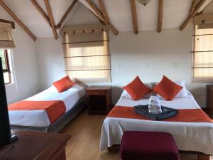Postel nebo postele na pokoji v ubytování hotel el portal de las Flores, Alojamiento Rural