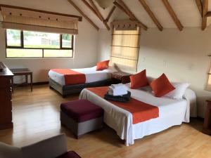 Postel nebo postele na pokoji v ubytování hotel el portal de las Flores, Alojamiento Rural
