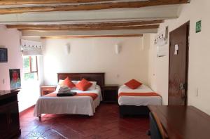Postel nebo postele na pokoji v ubytování hotel el portal de las Flores, Alojamiento Rural