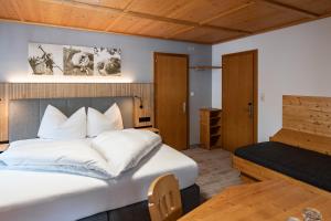 Posteľ alebo postele v izbe v ubytovaní Hotel Garni Madrisa