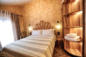 Postel nebo postele na pokoji v ubytování Hotel Labiatan