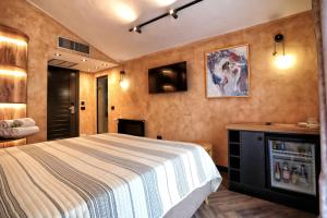 Postel nebo postele na pokoji v ubytování Hotel Labiatan