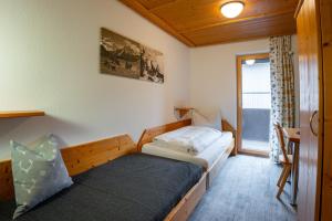 Posteľ alebo postele v izbe v ubytovaní Hotel Garni Madrisa