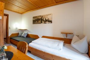 Posteľ alebo postele v izbe v ubytovaní Hotel Garni Madrisa