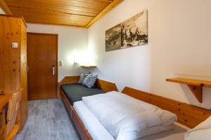 Posteľ alebo postele v izbe v ubytovaní Hotel Garni Madrisa