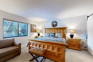 a bedroom with a bed and a couch and a window at Frisco Meadows in Frisco +26 photos