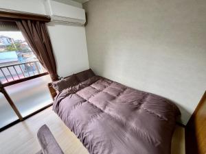 Postel nebo postele na pokoji v ubytování Apartment Hotel Kuki