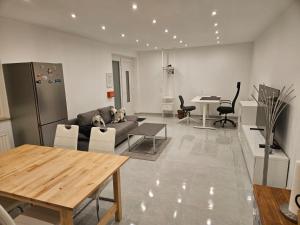 a living room with a couch and a table at Ferienwohnung Apartment Bornum am Harz in Bockenem