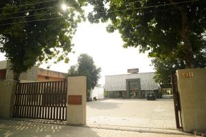 an entrance to a building with a gate in front at Hotel Tanveer, Kurali in Kūrāli