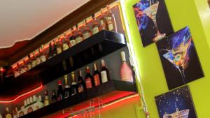 a refrigerator filled with lots of bottles of alcohol at Rustic Gardens Bed & Breakfast Kitunzi Lungujja in Kampala