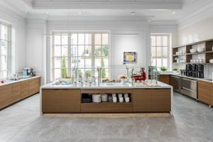 a large kitchen with a large island in the middle at AC Hotel by Marriott Spartanburg in Spartanburg